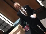 A Capitol Concierge employee hands out 