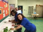 The Capitol Concierge team enjoys a group activity during Community Service Day at Duckworth elementary school in Beltsville, MD